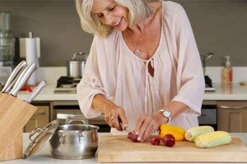 Lady cutting vegetables