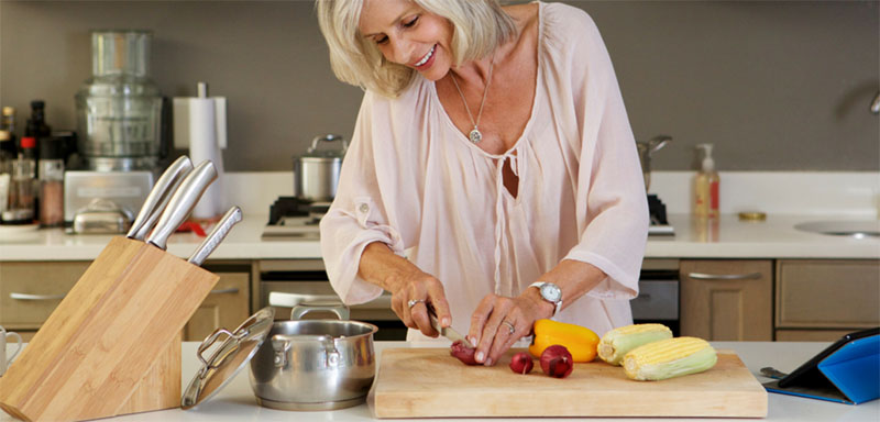 Lady cutting vegetables